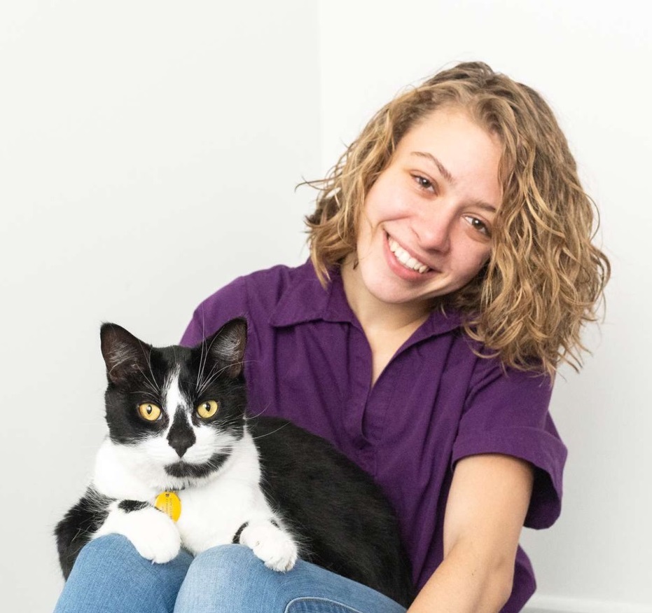 Gwen with a black and white cat